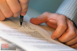 Man's Hands Signing Document --- Image by © Royalty-Free/Corbis